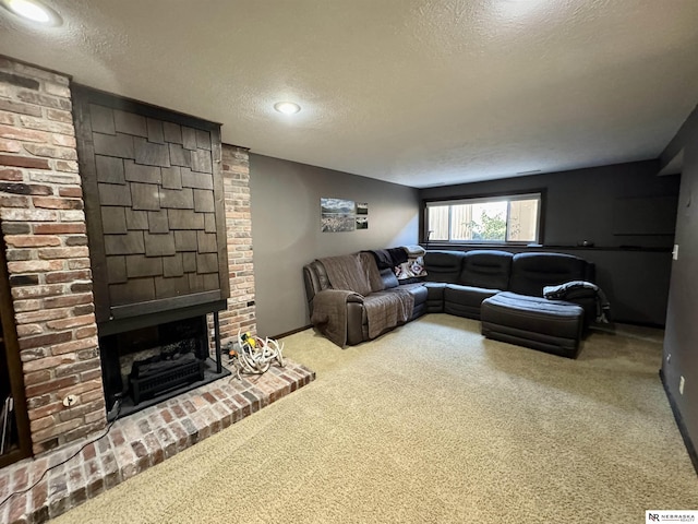 living room with a fireplace, a textured ceiling, and carpet flooring