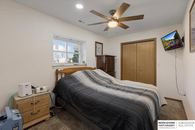 bedroom with carpet, ceiling fan, and a closet