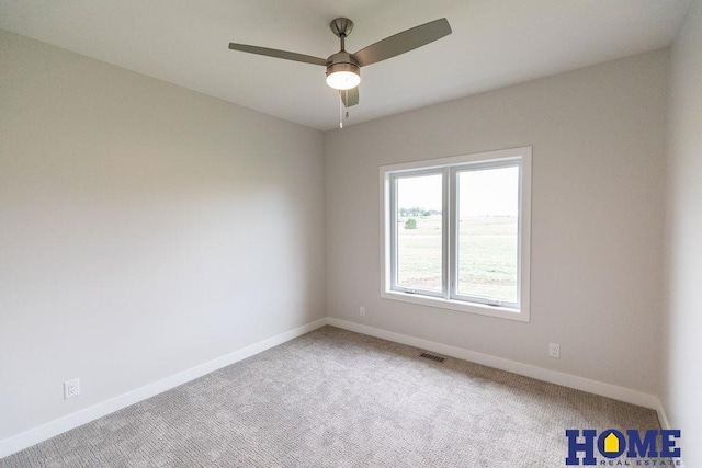 unfurnished room featuring ceiling fan and carpet floors