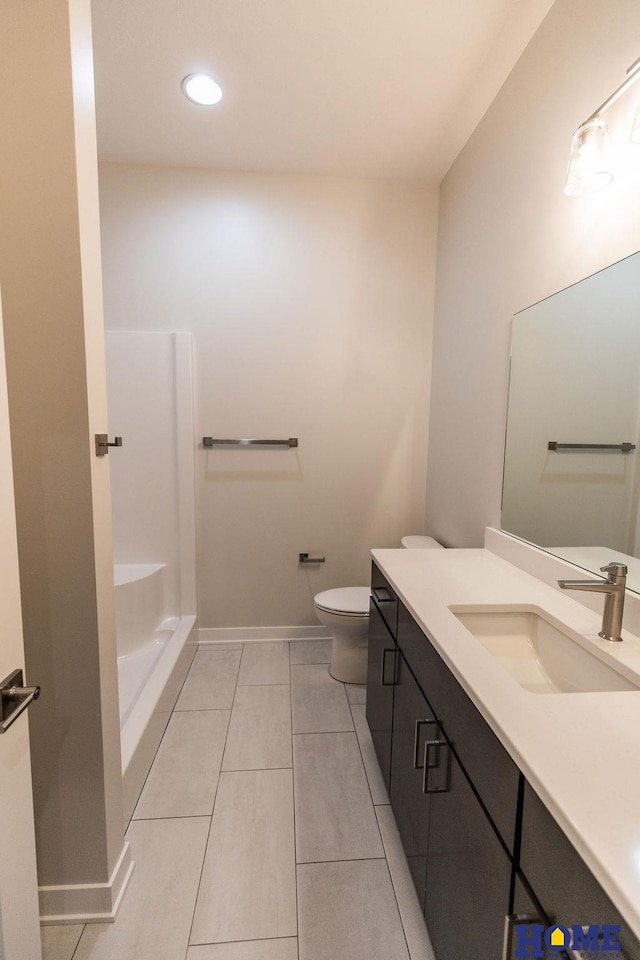 bathroom with toilet, tile patterned flooring, walk in shower, and vanity