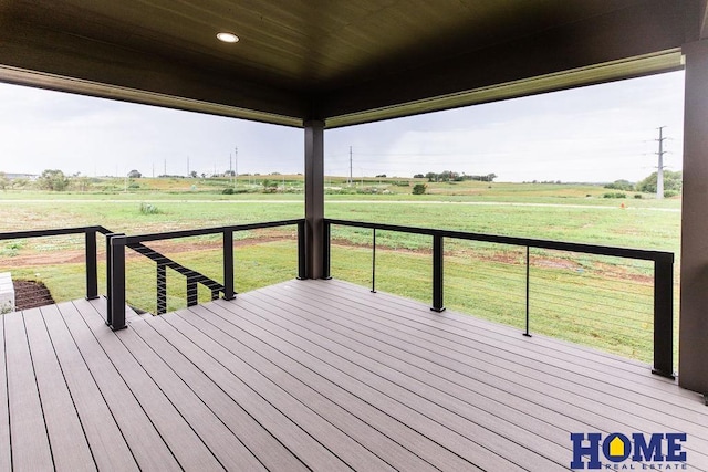 wooden terrace featuring a rural view