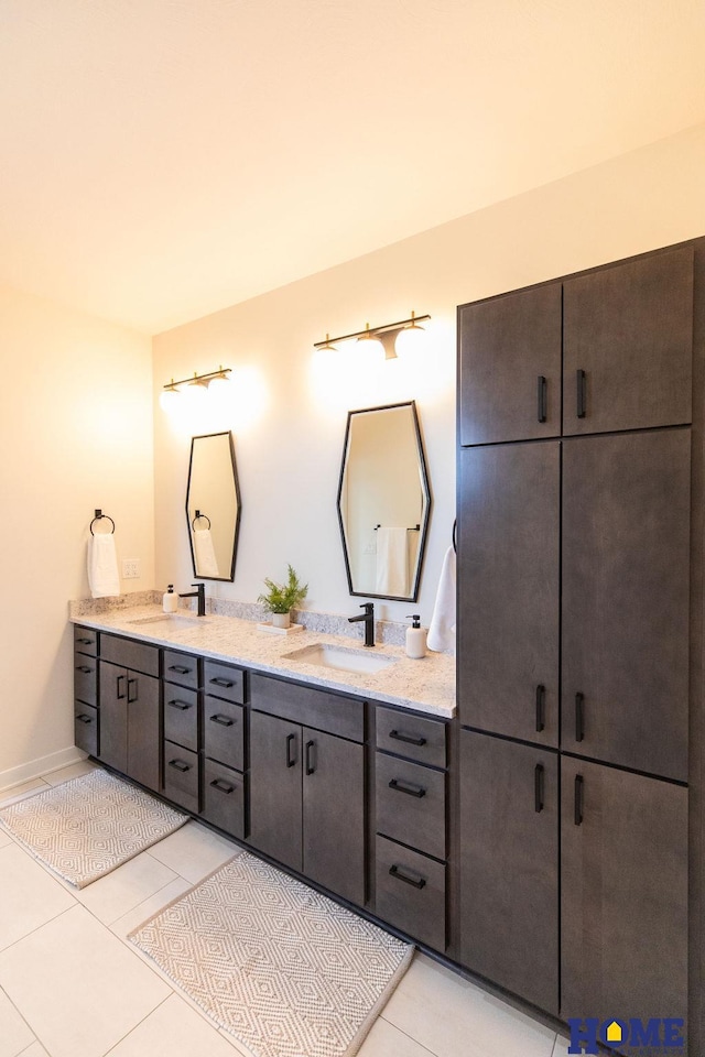 bathroom with tile patterned floors and vanity