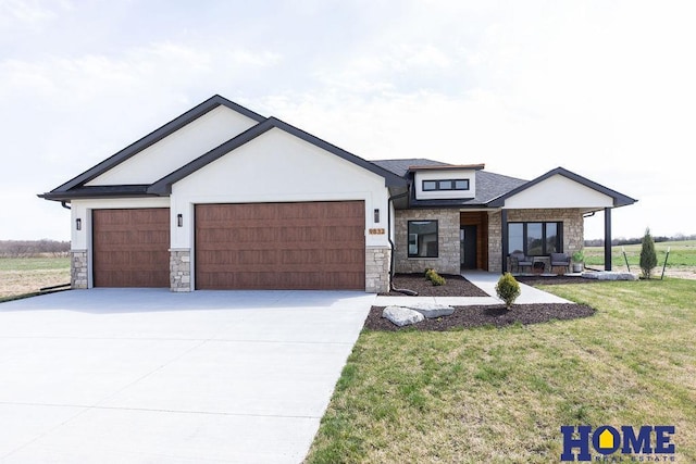 view of front of property with a garage and a front yard