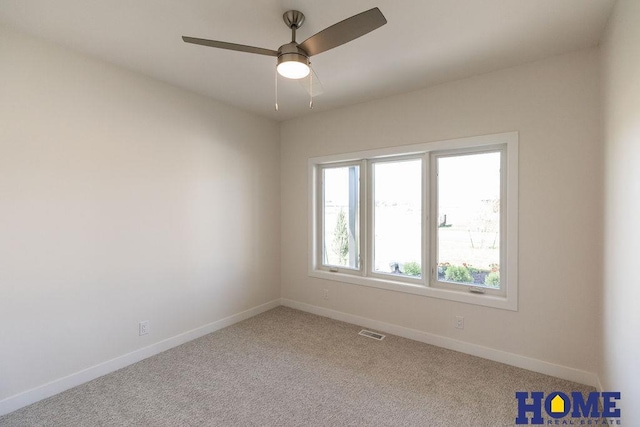 carpeted empty room with ceiling fan