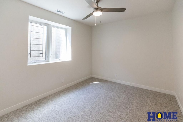 carpeted spare room featuring ceiling fan