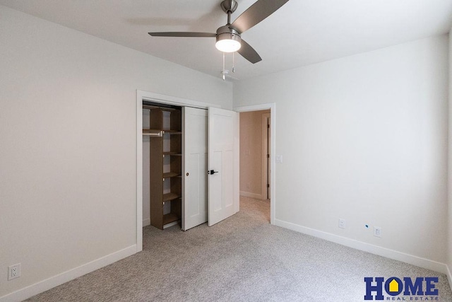 unfurnished bedroom with ceiling fan, a closet, and light carpet