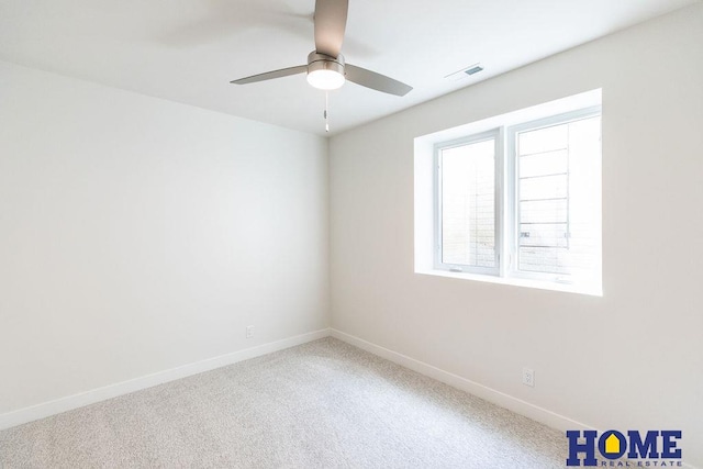 spare room with ceiling fan and carpet flooring