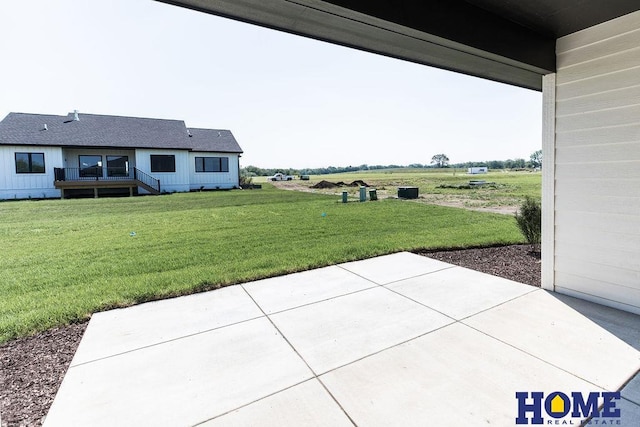 view of yard featuring a rural view and a patio area