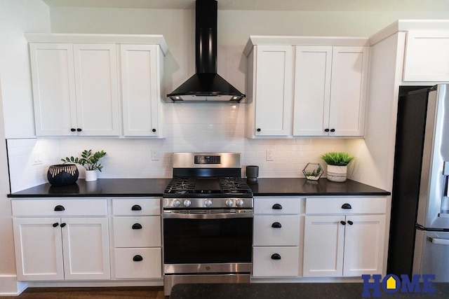 kitchen featuring stainless steel appliances, wall chimney exhaust hood, white cabinets, and tasteful backsplash