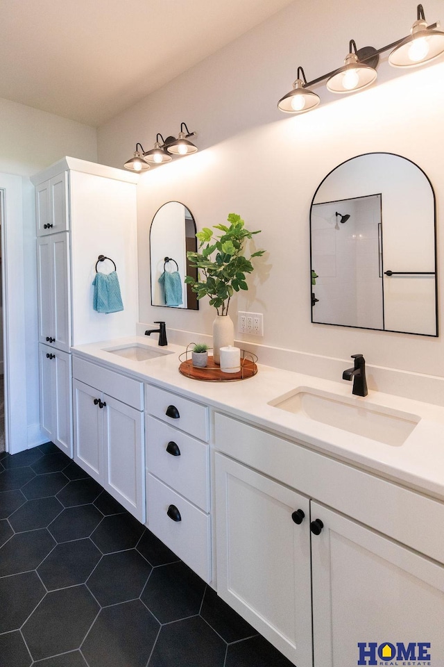 bathroom with tile patterned floors and vanity