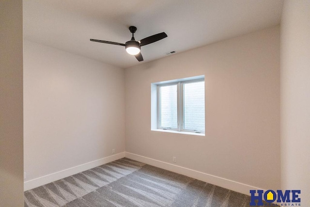 empty room with carpet and ceiling fan