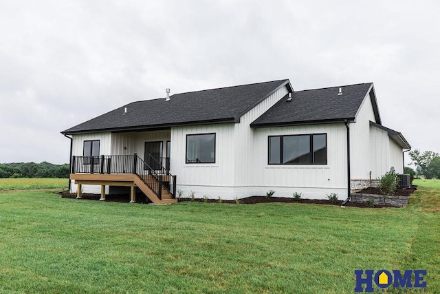 back of house with a wooden deck, cooling unit, and a yard