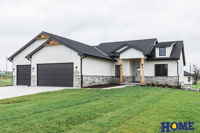 modern inspired farmhouse with a front yard and a garage