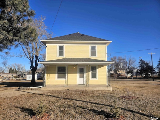 rear view of house featuring a patio and fence