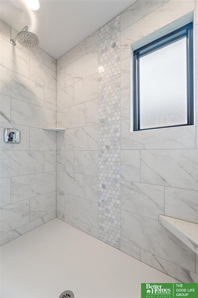 bathroom featuring tiled shower