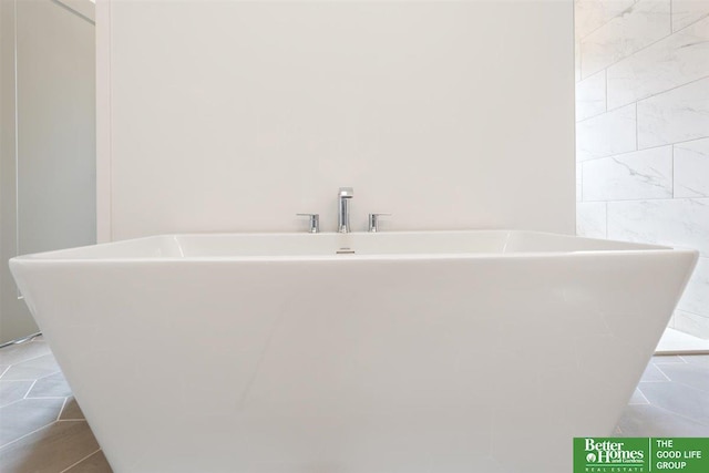 bathroom featuring a tub to relax in