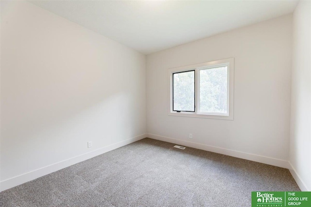 empty room featuring carpet flooring