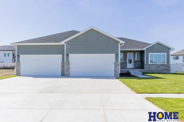 view of front of home featuring a garage and a front yard