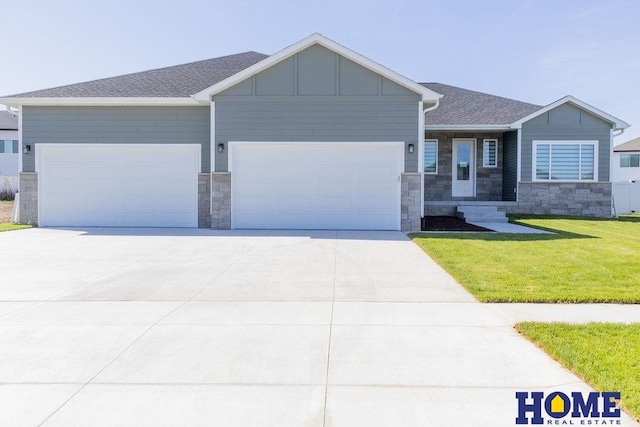 view of front of property with a garage and a front yard