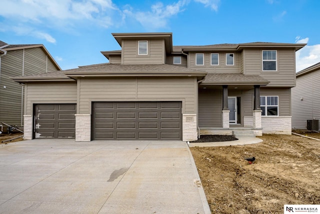 prairie-style home featuring a garage