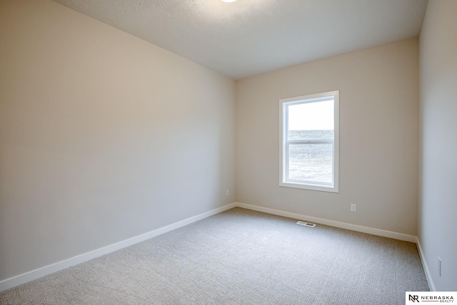 spare room with carpet floors