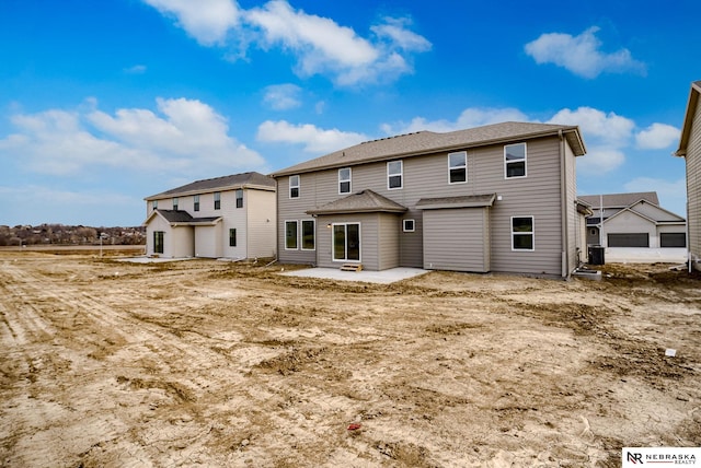 rear view of house featuring a patio area and central AC unit