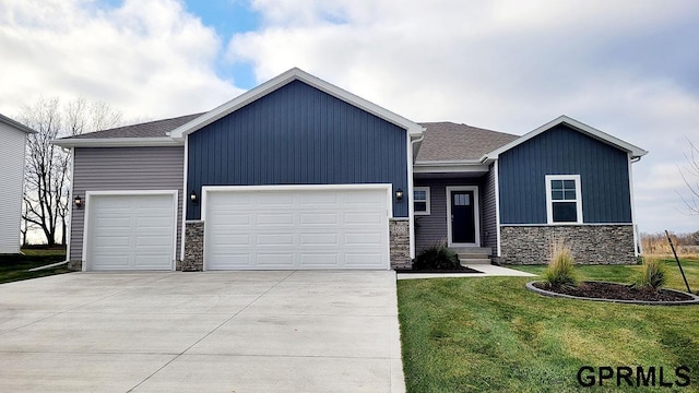 view of front facade with a front lawn and a garage