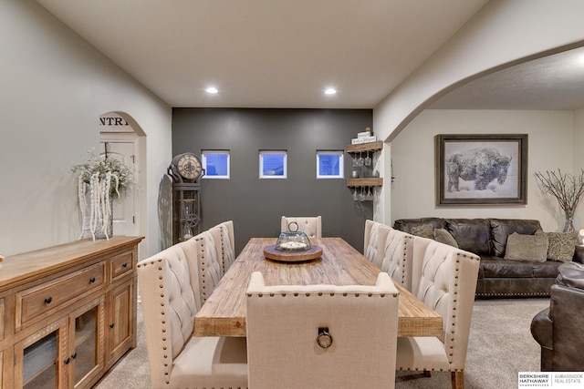 dining area featuring light colored carpet