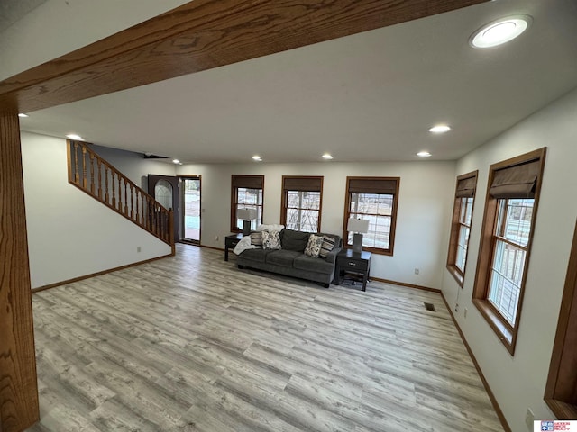 unfurnished living room featuring light hardwood / wood-style flooring