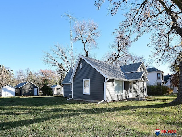 view of home's exterior featuring covered porch and a yard