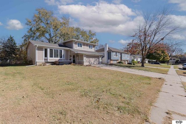 view of front of house featuring a garage and a front yard