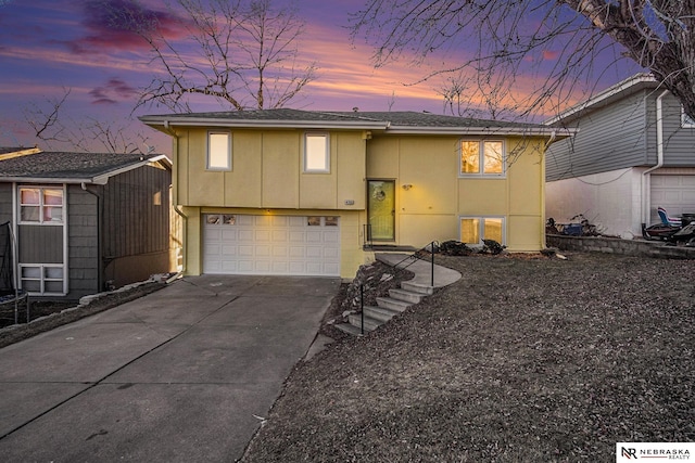 raised ranch featuring a garage