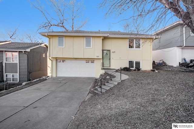 split foyer home featuring a garage