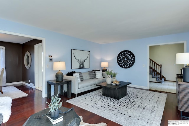 living room with dark hardwood / wood-style flooring