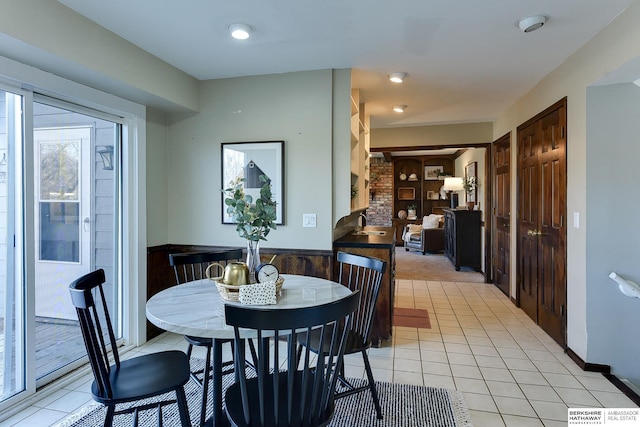 dining area with light tile patterned flooring