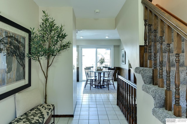 hallway with light tile patterned floors