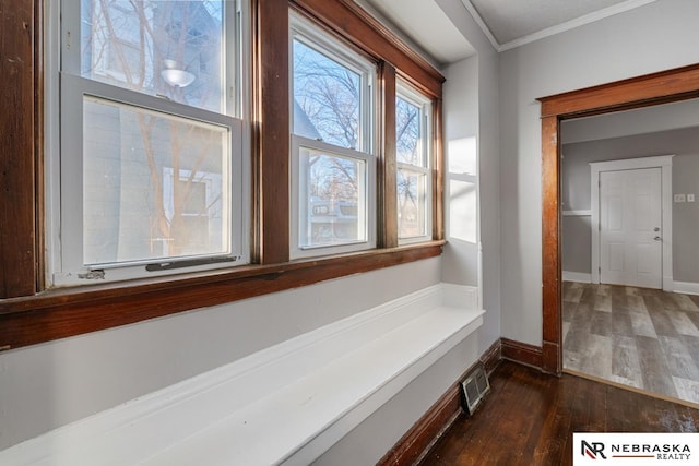 bathroom with wood-type flooring and crown molding