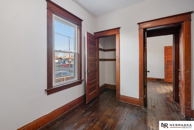 hallway featuring dark hardwood / wood-style flooring