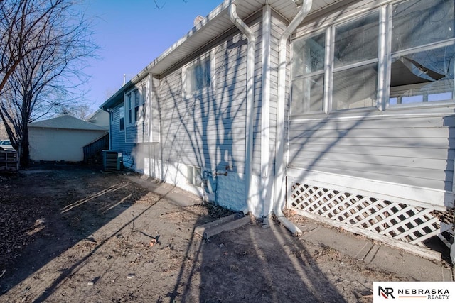 view of side of property featuring cooling unit