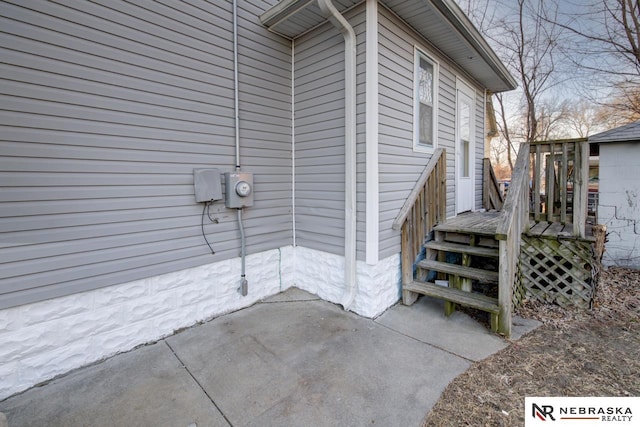 view of side of property with a patio