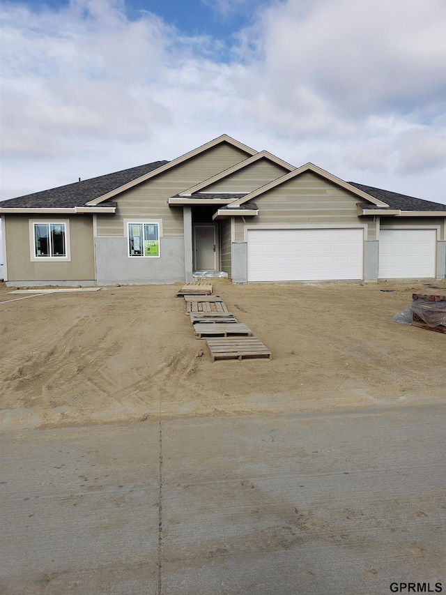 ranch-style home with a garage