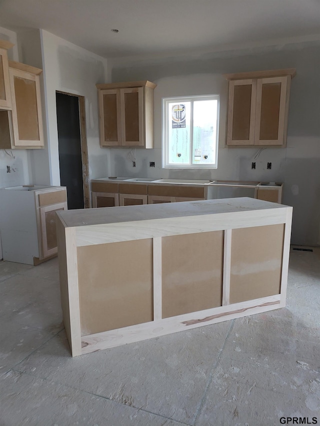 kitchen featuring light brown cabinets