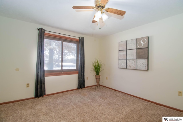 empty room with carpet floors and ceiling fan