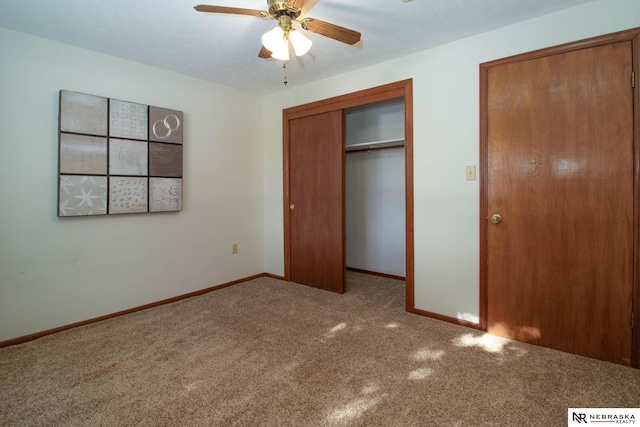 unfurnished bedroom with carpet floors, a closet, and ceiling fan