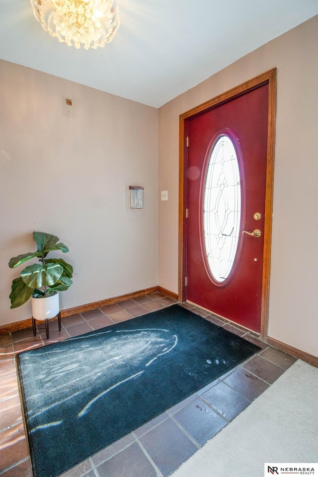 entryway featuring an inviting chandelier