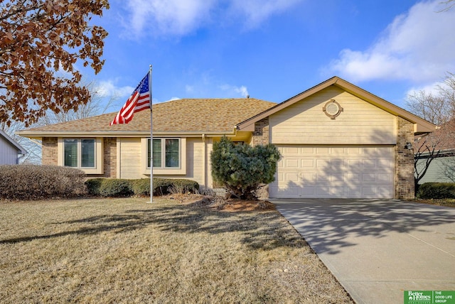 ranch-style home featuring a front yard and a garage