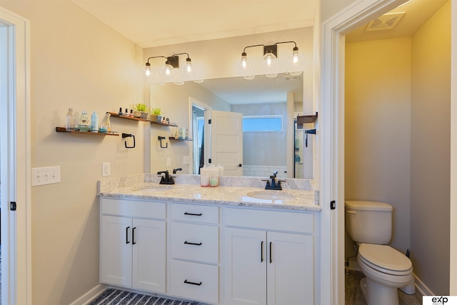 bathroom with vanity and toilet