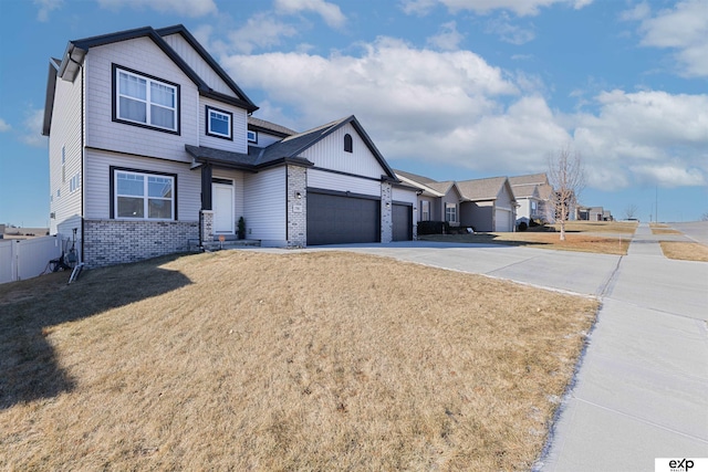 view of front of house featuring a garage and a front lawn