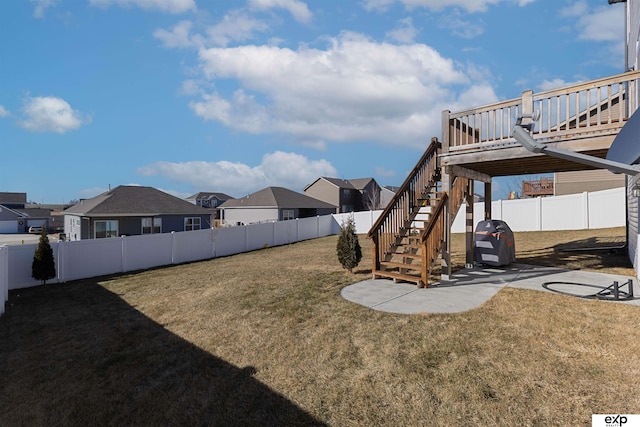 view of yard featuring a wooden deck and a patio area