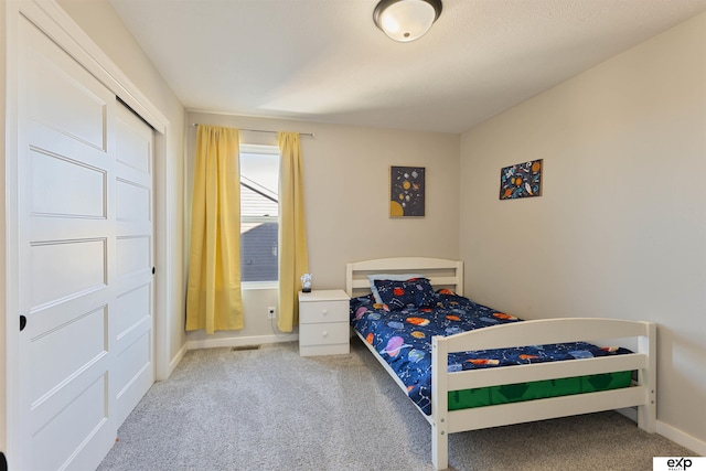 bedroom with light carpet